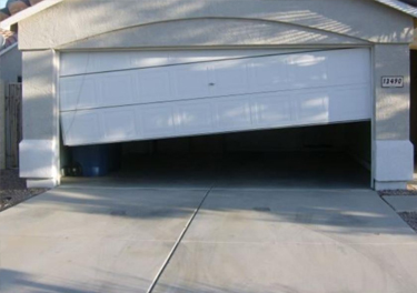 garage door off track repair in in Ojai